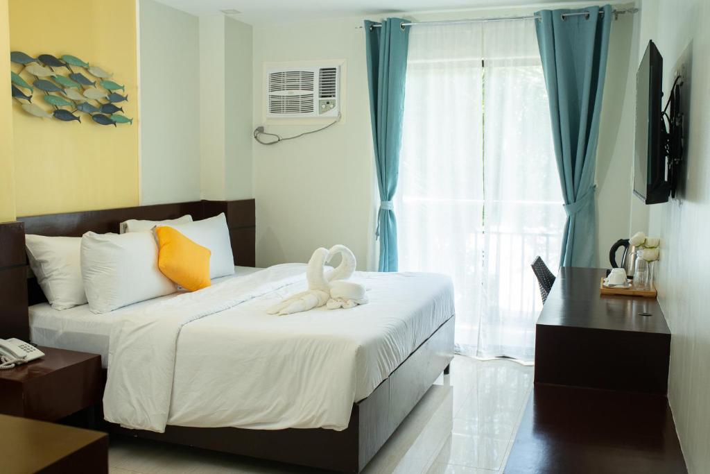 Cama o camas de una habitación en Bloom Boracay