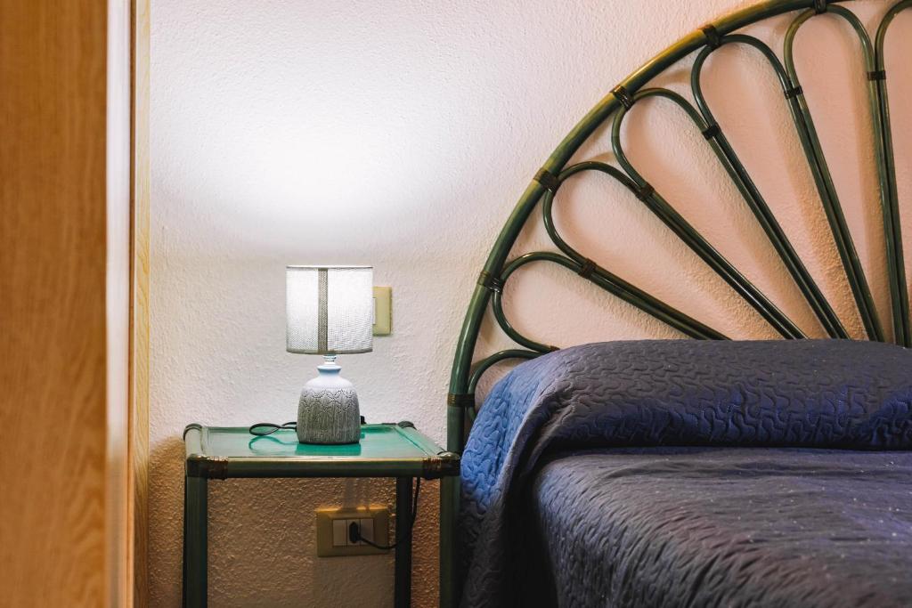 Łóżko lub łóżka w pokoju w obiekcie Oasi del Relax