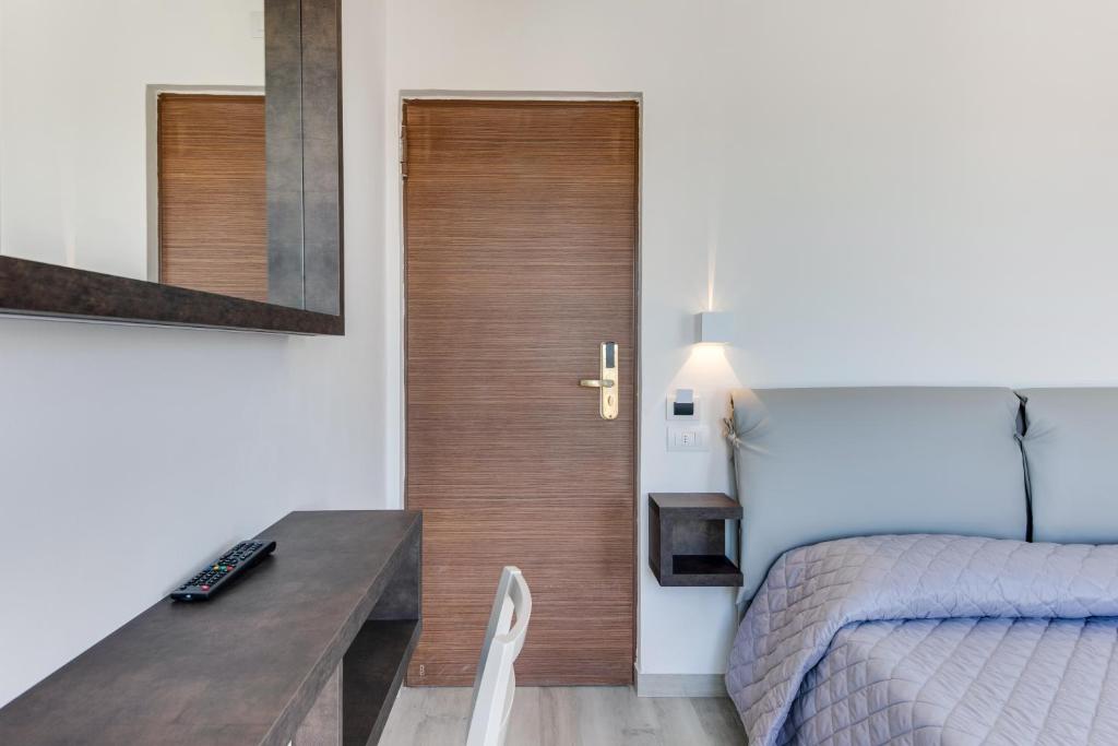 Postel nebo postele na pokoji v ubytování MARITTIMO Riccione - Hotel Clipper FRONTE MARE