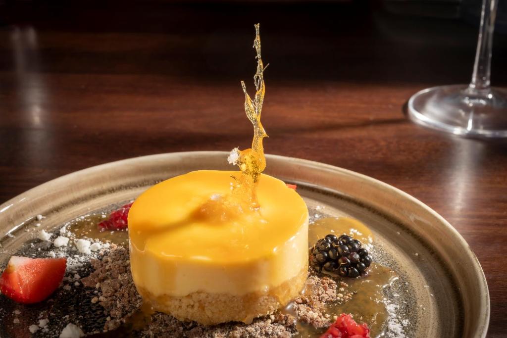a dessert on a plate on a table at Maldron Hotel Brighton City Centre in Brighton & Hove