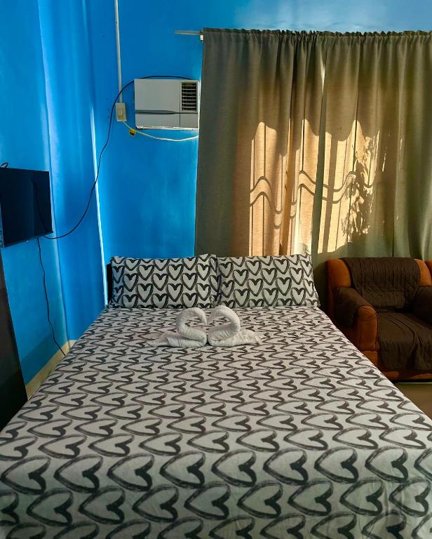 Postel nebo postele na pokoji v ubytování Rozay Travellers Inn