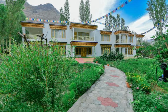 a large house with a path in front of it at Hotel Onpo Hunder Nubra Valley in Hundar