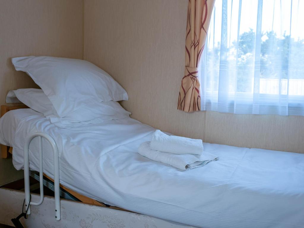 Postel nebo postele na pokoji v ubytování Broom Leisure Camping Pods
