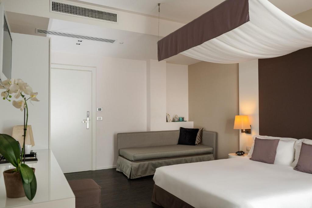 Postel nebo postele na pokoji v ubytování Hotel Ines