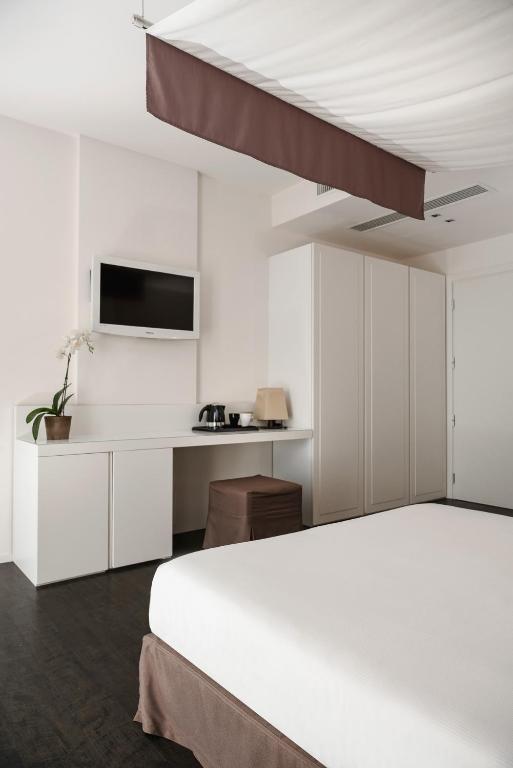 Postel nebo postele na pokoji v ubytování Hotel Ines