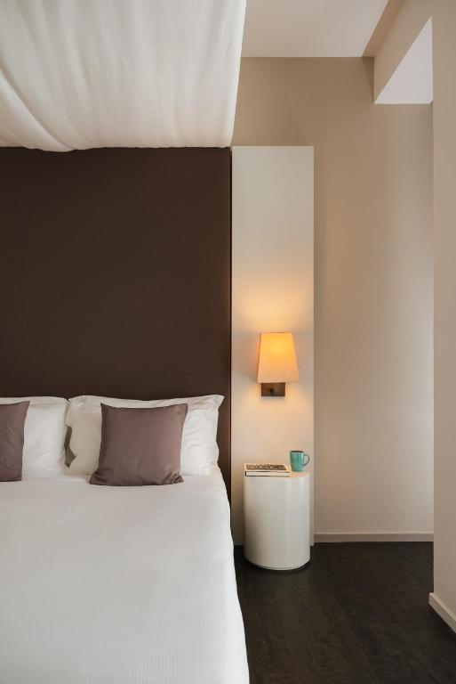 Postel nebo postele na pokoji v ubytování Hotel Ines