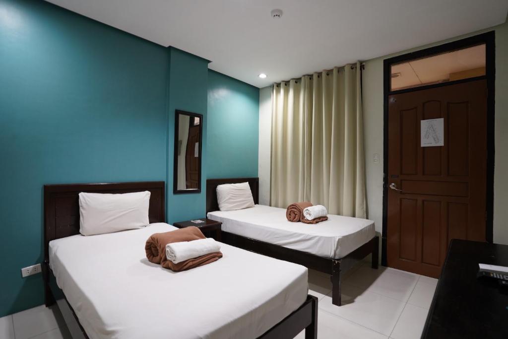 Llit o llits en una habitació de Arzo Hotel Grand Lodge
