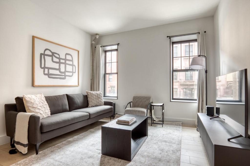 a living room with a couch and a table at Brooklyn Heights 2br w elevator wd NYC-1066 in Brooklyn