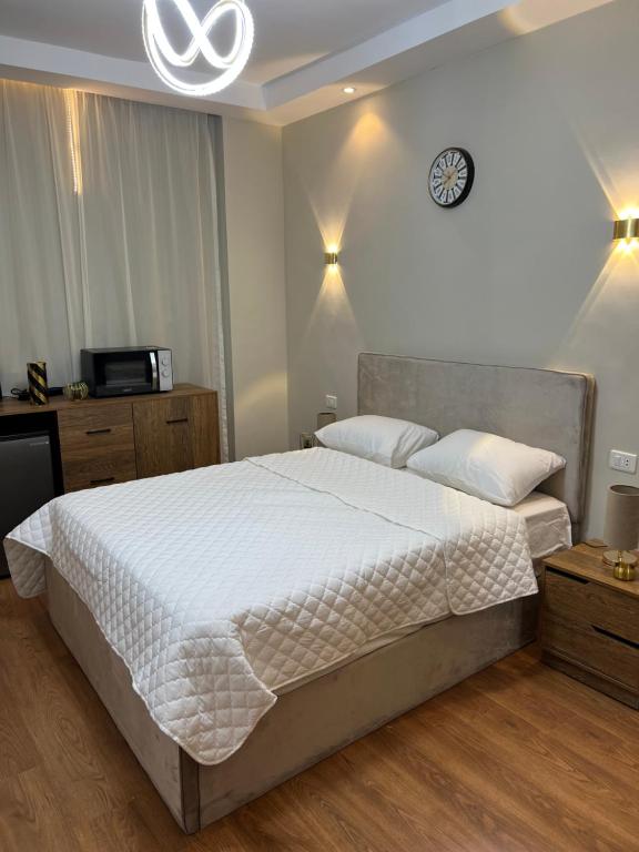 Postel nebo postele na pokoji v ubytování Cozy Royal Rooms in new cairo