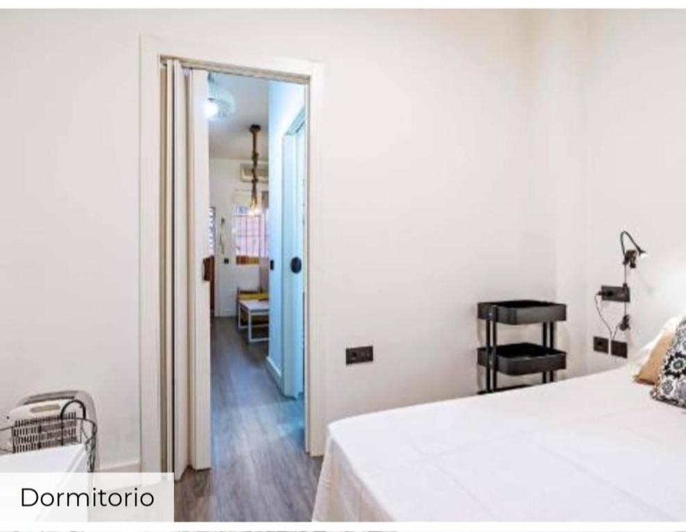 a bedroom with a door open to a room at Apartamento Mar in Aguadulce