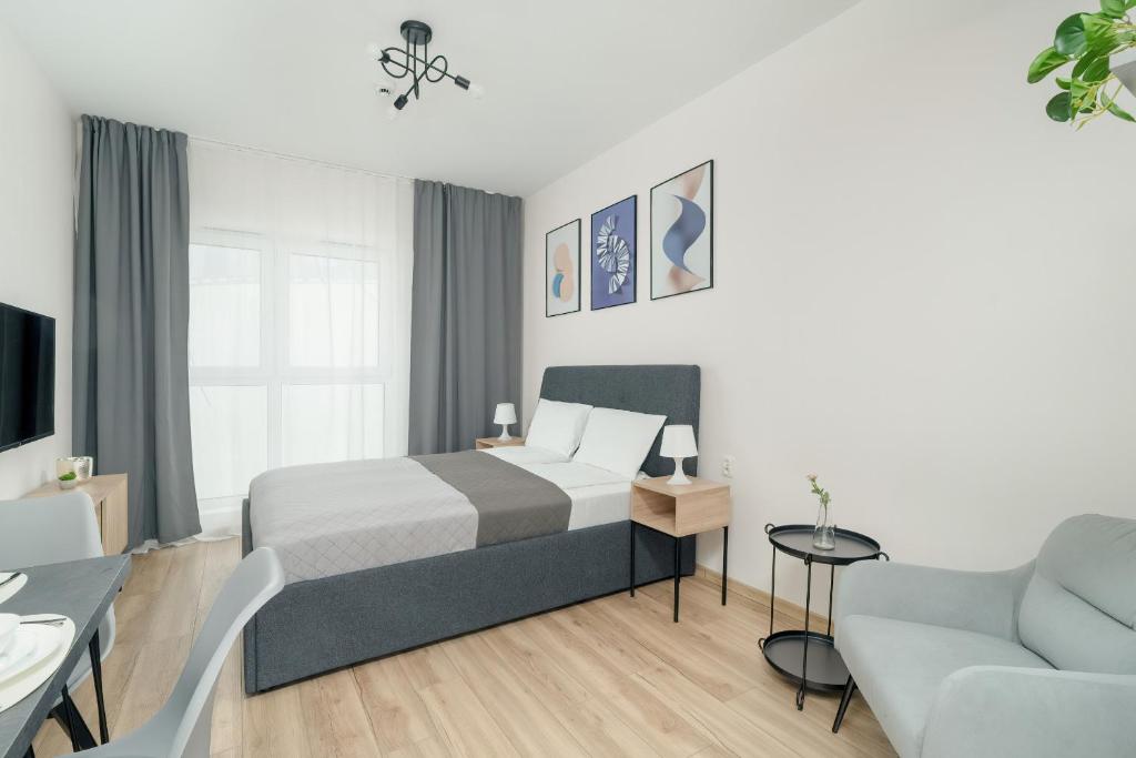 Postel nebo postele na pokoji v ubytování Old Market Square Modern Studios in Poznań by Renters