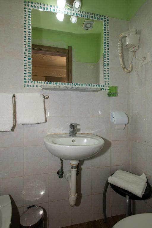 Koupelna v ubytování Hotel Piola