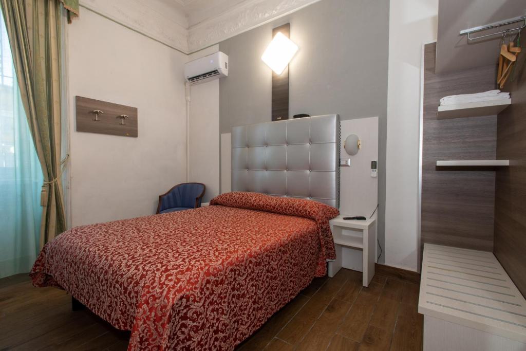 Postel nebo postele na pokoji v ubytování Hotel Piola
