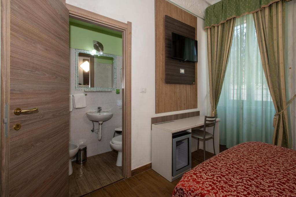 Postel nebo postele na pokoji v ubytování Hotel Piola