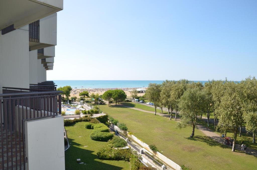 a view of a park from a balcony at Savoy Beach Hotel & Thermal Spa in Bibione