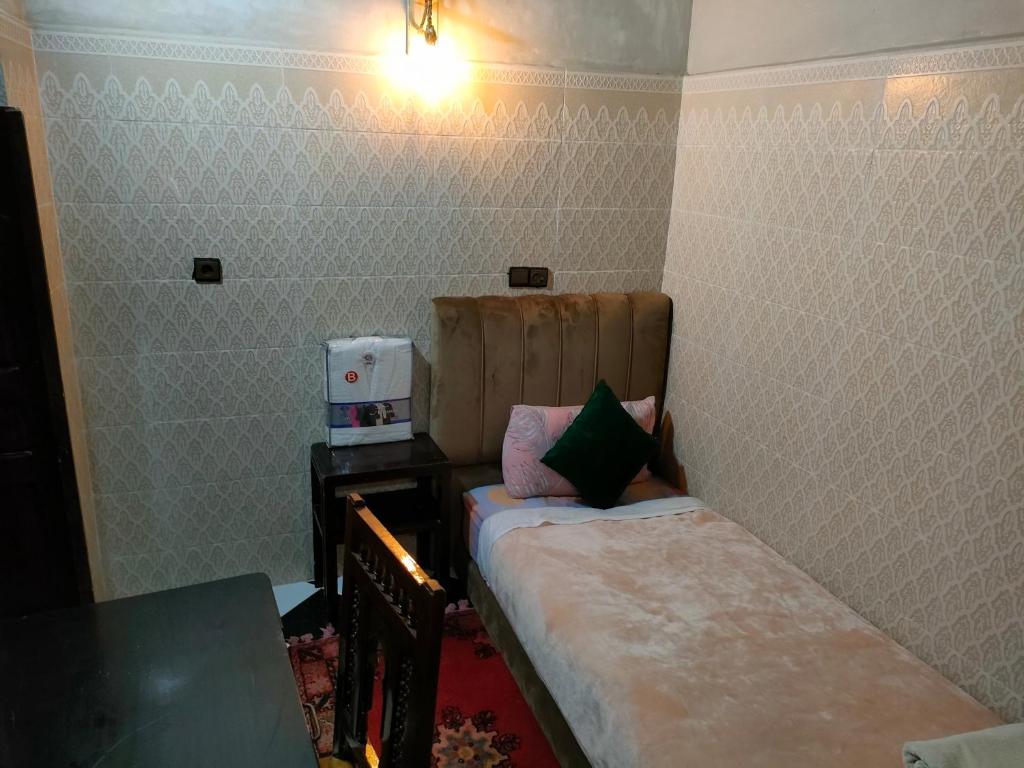 Postel nebo postele na pokoji v ubytování RIAD Tamazouzt