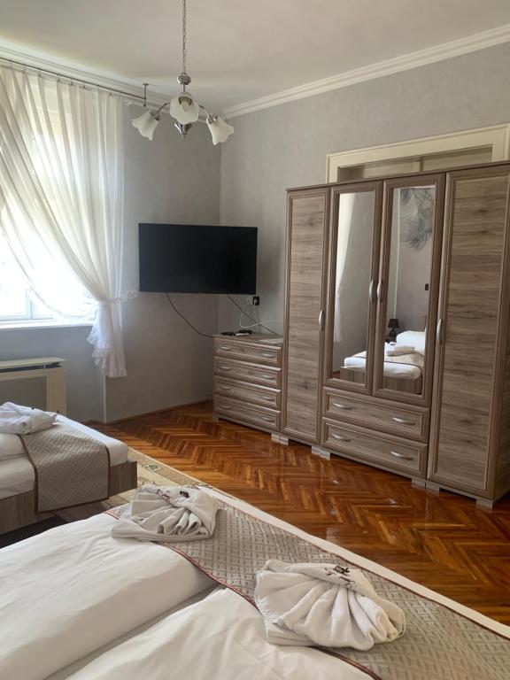 Posteľ alebo postele v izbe v ubytovaní Szent István Apartman