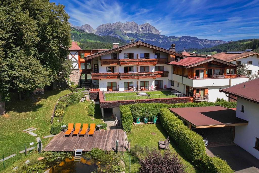 an aerial view of a house with a garden at Dorfresort Kitzbühel by ALPS RESORTS in Reith bei Kitzbühel