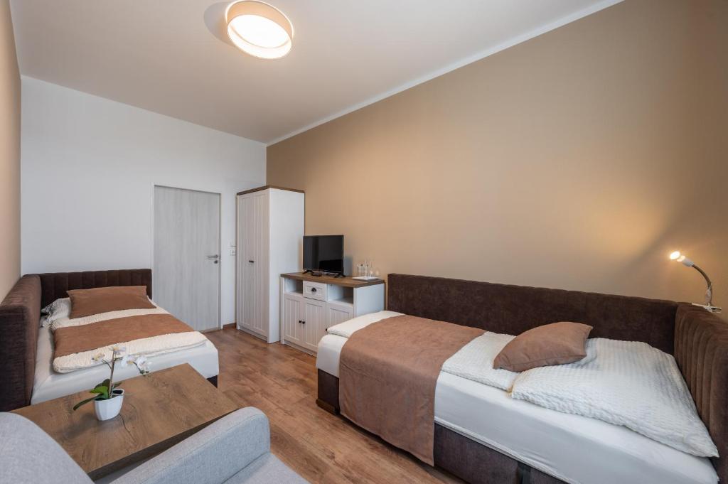 Postel nebo postele na pokoji v ubytování Vila Astoria