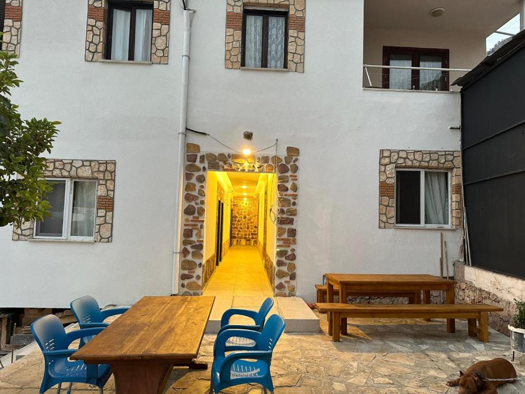 a patio with a table and chairs and a building at Zen house in Kas