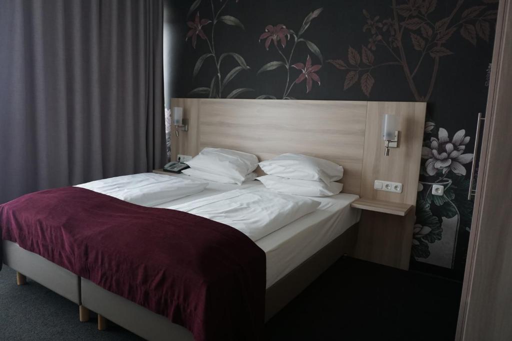 Postel nebo postele na pokoji v ubytování Hotel Senator München