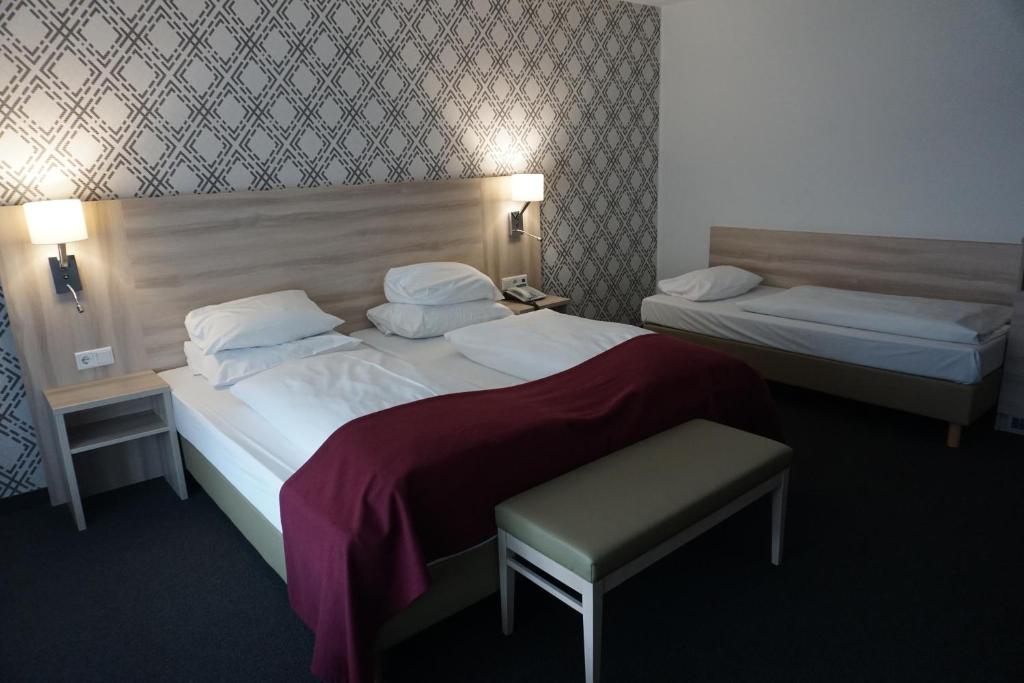 Postel nebo postele na pokoji v ubytování Hotel Senator München