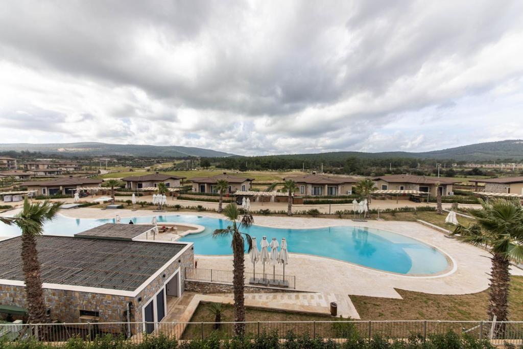 an image of a pool at a resort at Luxury Villa w Pool Balcony in Regnum Golf Club in Çamlık