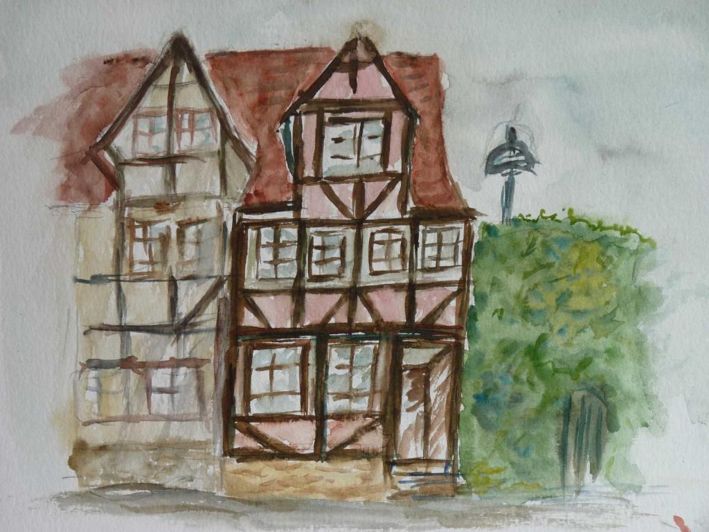 een tekening van een huis met een straatlicht bij Ferienhaus Rosa Blume in Hannoversch Münden