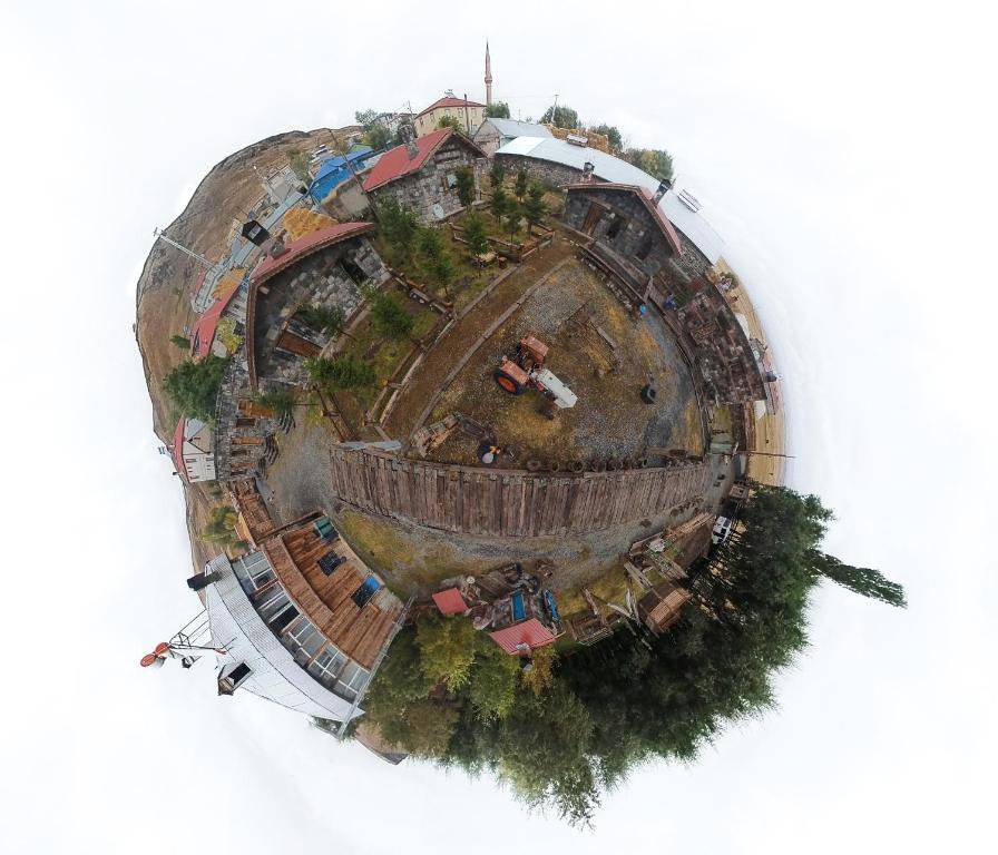 an overhead view of a large building in a park at Doğunun Taş Evleri in Selim