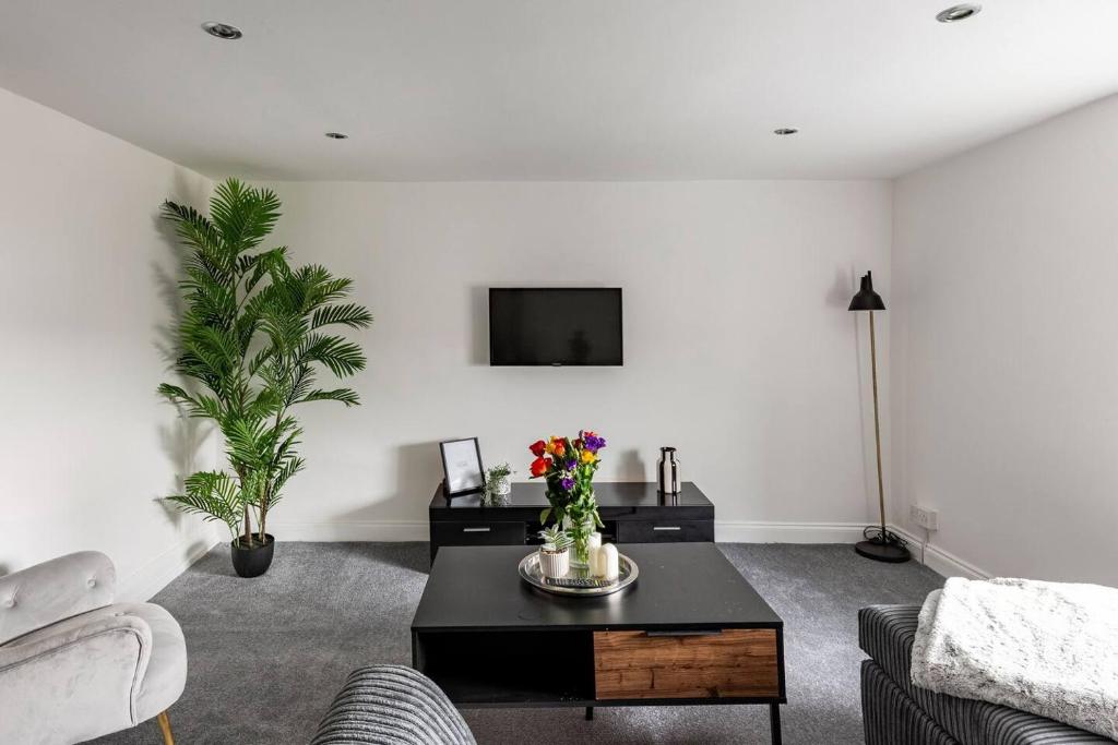 a living room with a couch and a table at Modern 2-Bed Gem in Picturesque Ramsgate Central Location in Kent