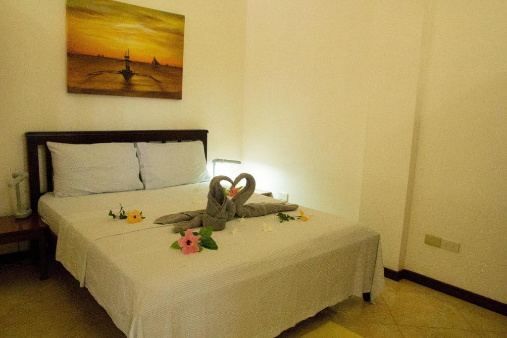 Postel nebo postele na pokoji v ubytování Greenyard Inn