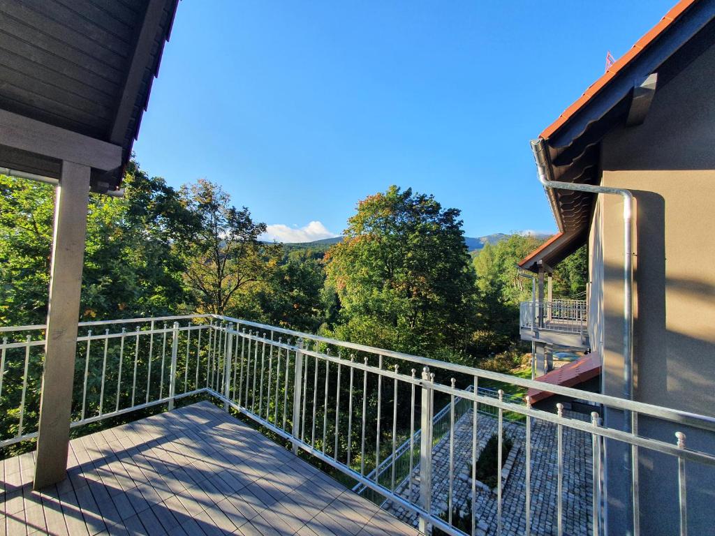 a balcony of a house with a view of trees at Apartamenty Bliżej Nieba - Jagniątków in Jelenia Góra