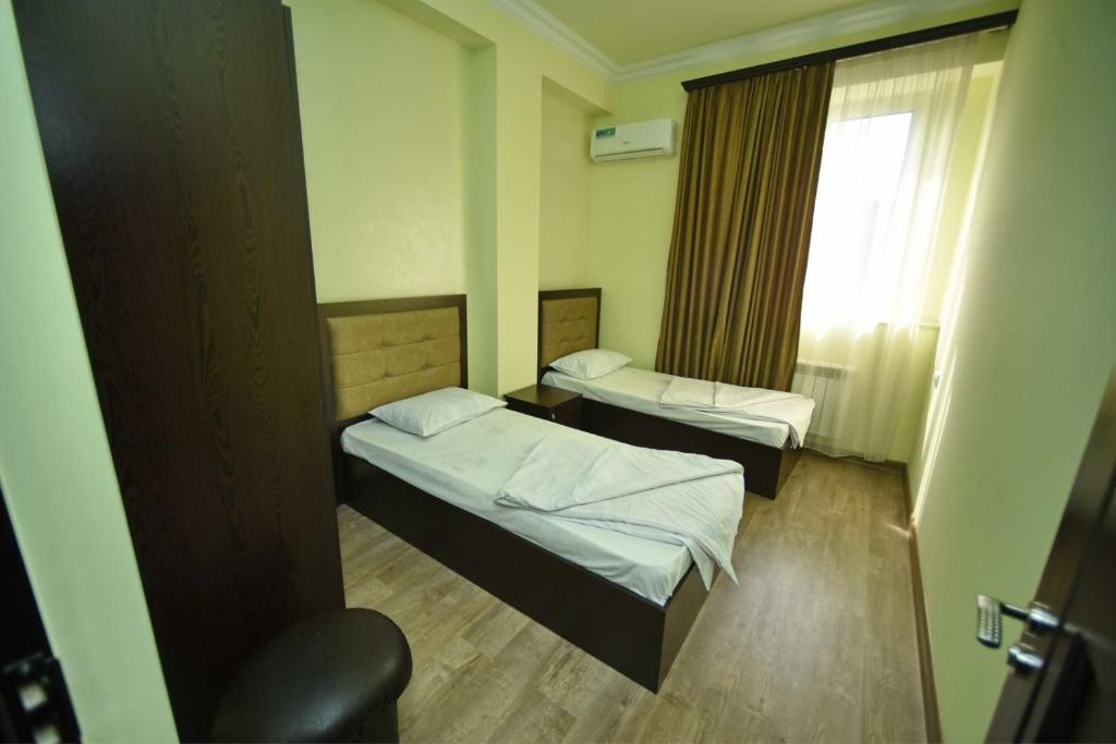 Postel nebo postele na pokoji v ubytování Express Hotel