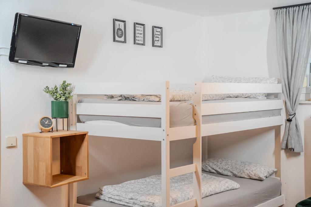 Postel nebo postele na pokoji v ubytování Gästehaus J. Baumann
