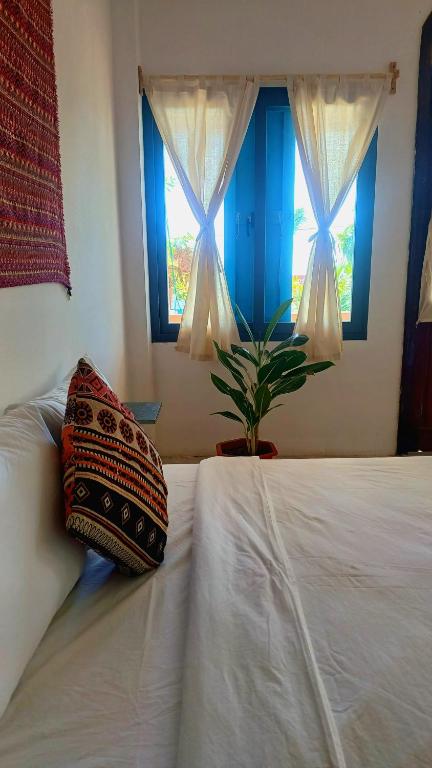 Giường trong phòng chung tại Maidi Homestay Mui Ne