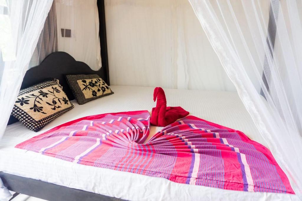 Postel nebo postele na pokoji v ubytování Mountain Relax Inn