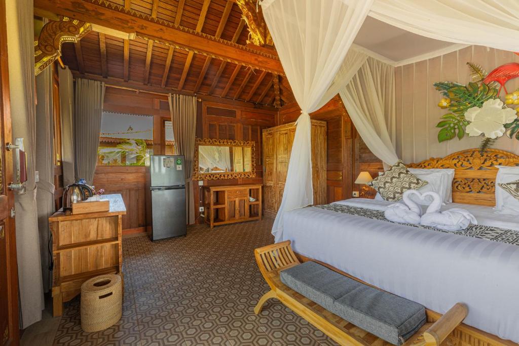 Postel nebo postele na pokoji v ubytování Billys Ayodya Villa