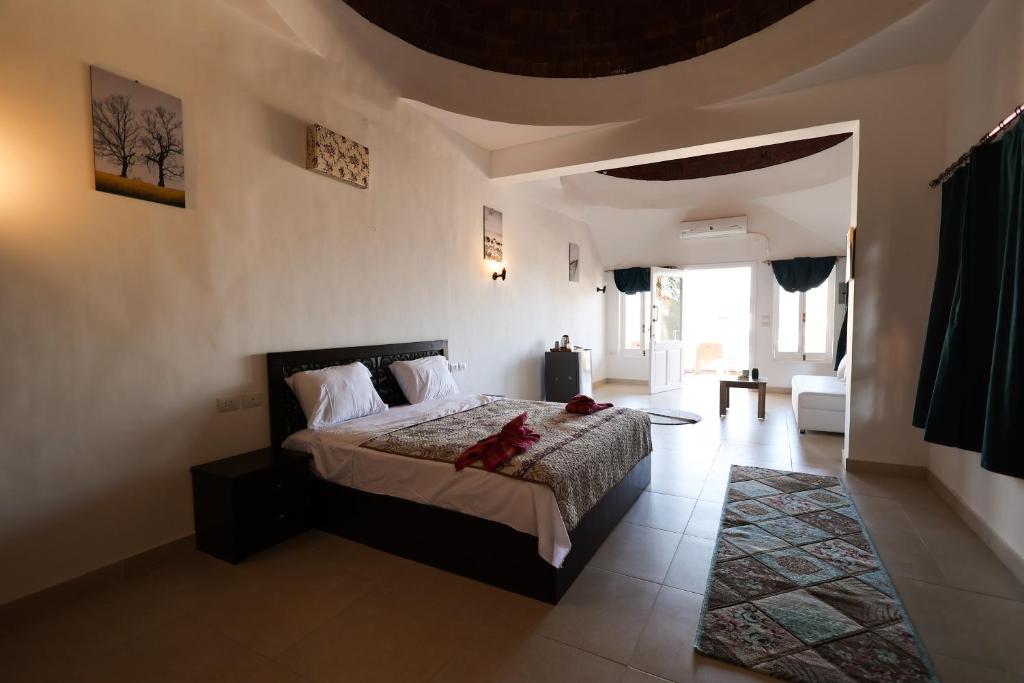 a bedroom with a large bed in a room at Sunshine Divers Club in Sharm El Sheikh