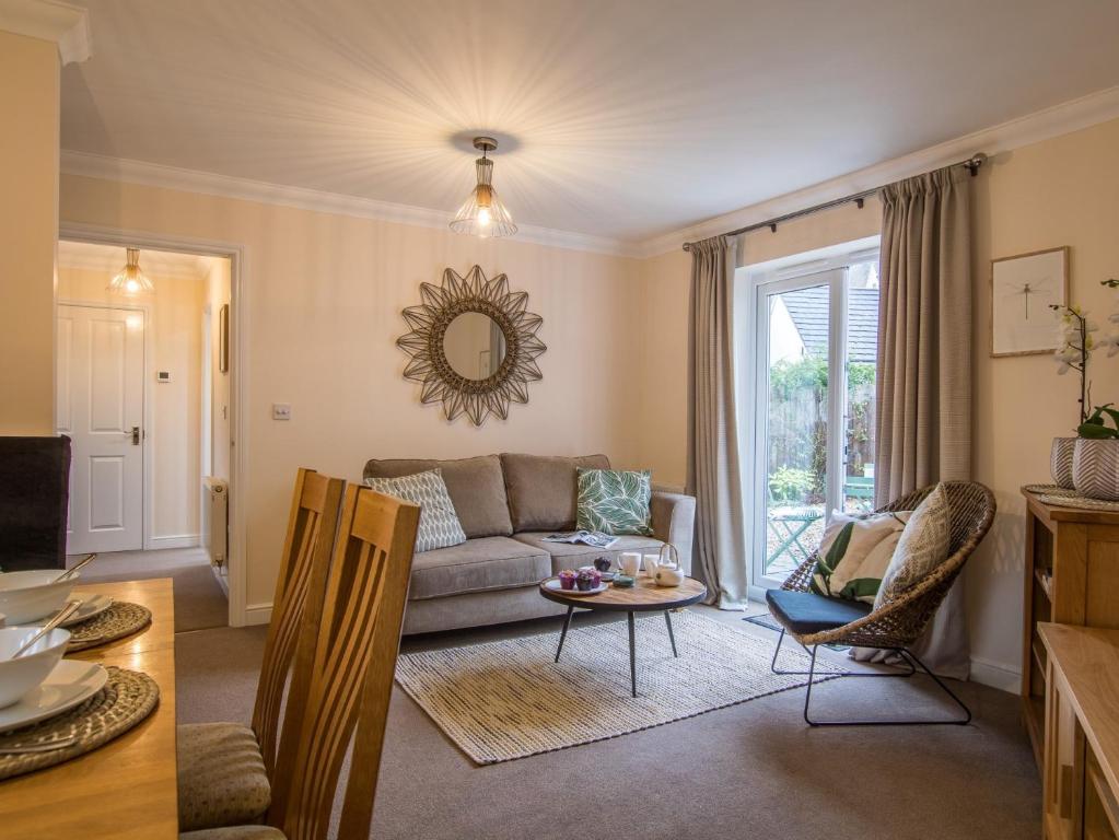 a living room with a couch and a table at 3 bed in Bampton 77931 in Bampton