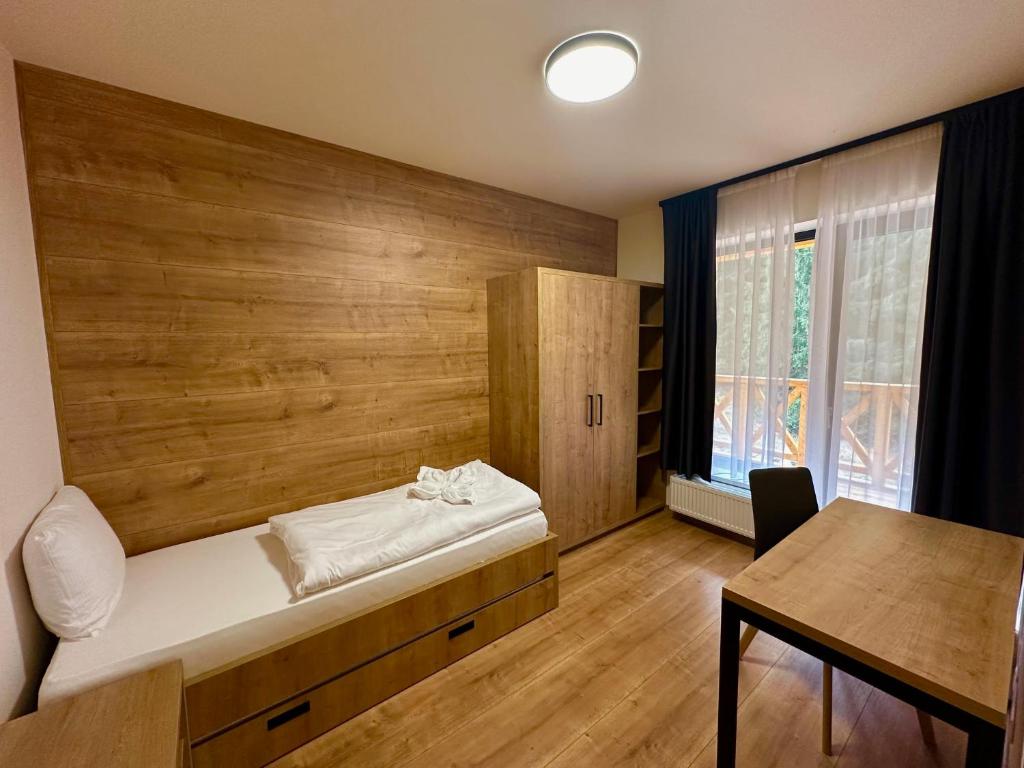 Postel nebo postele na pokoji v ubytování Resort Lucky Jasna