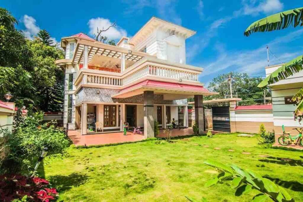 a large house with a yard at The Ruby Park in Yelagiri