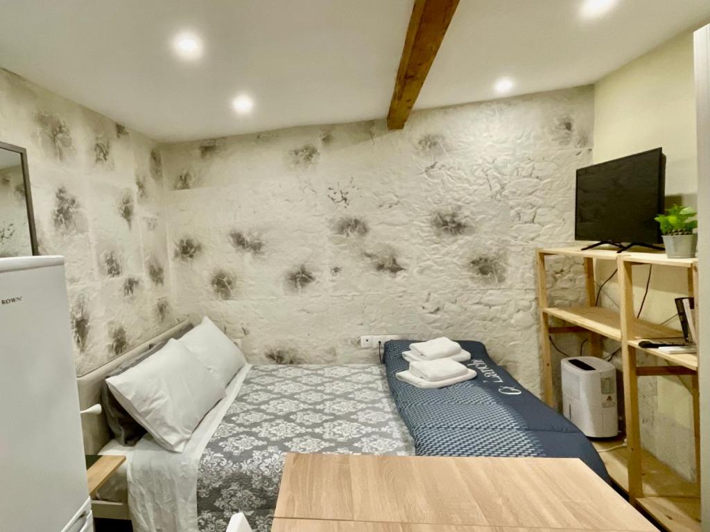 A bed or beds in a room at Corfu Old Town’s Cutiest Place