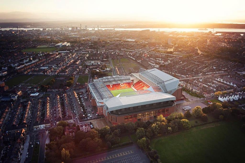 an aerial view of a stadium with a tennis court at Anfield end terraced home in Liverpool