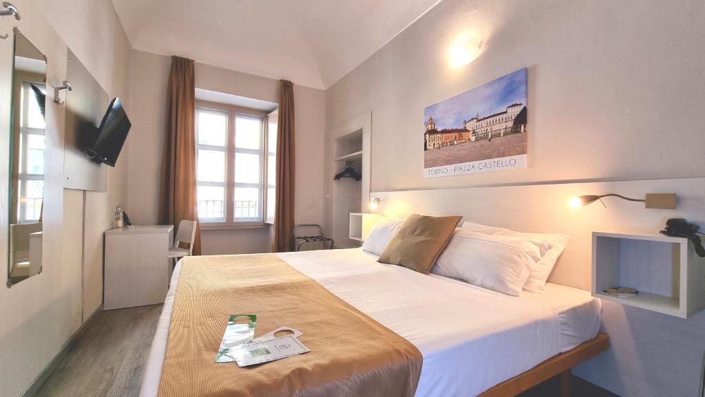 Postel nebo postele na pokoji v ubytování Green Class Hotel Astoria