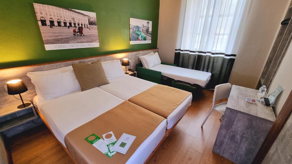 Postel nebo postele na pokoji v ubytování Green Class Hotel Astoria
