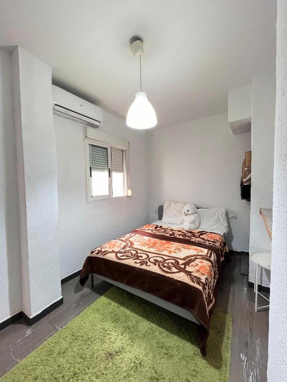 Postel nebo postele na pokoji v ubytování HotSpot Valencia