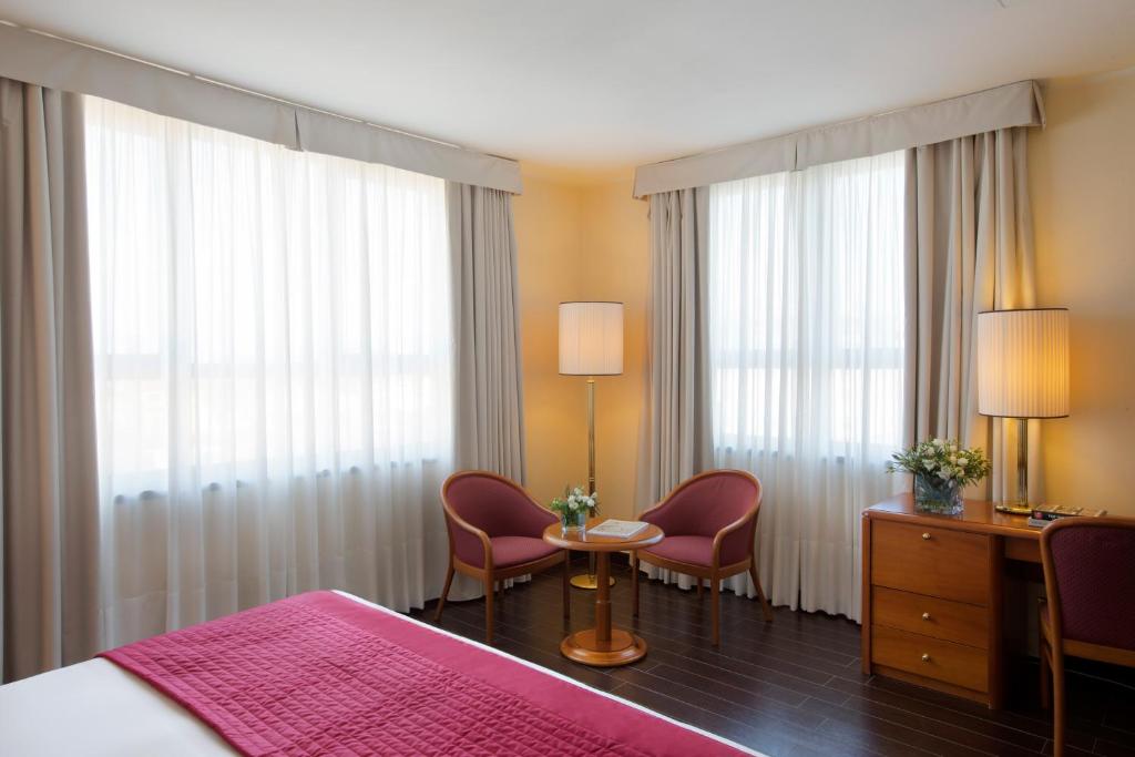 Posteľ alebo postele v izbe v ubytovaní Starhotels Business Palace
