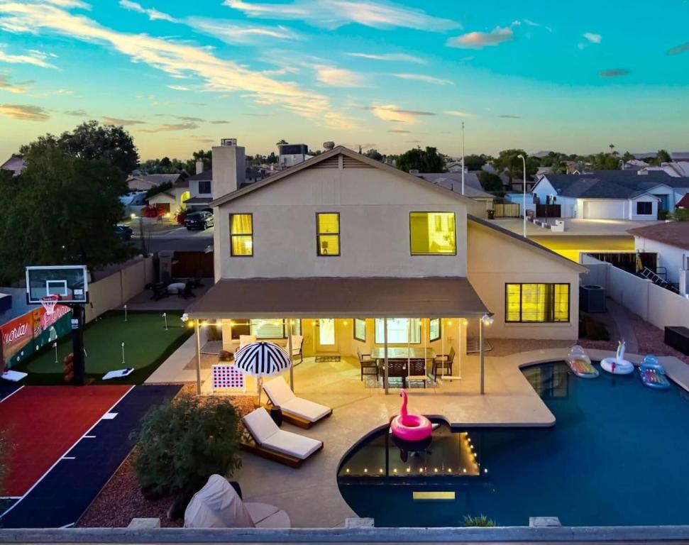 an aerial view of a house with a pool at Peoria Paradise Sportscourt Heated Pool Gameroom in Peoria