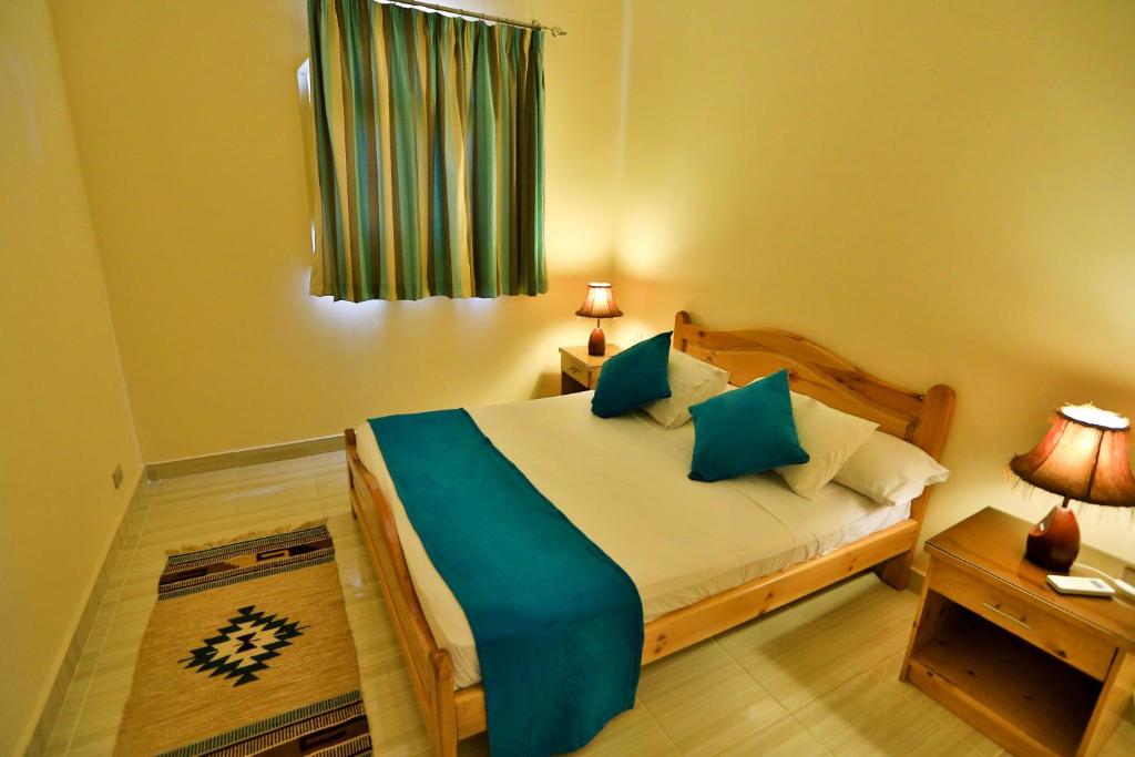 Postel nebo postele na pokoji v ubytování Sheikh Ali Dahab Resort