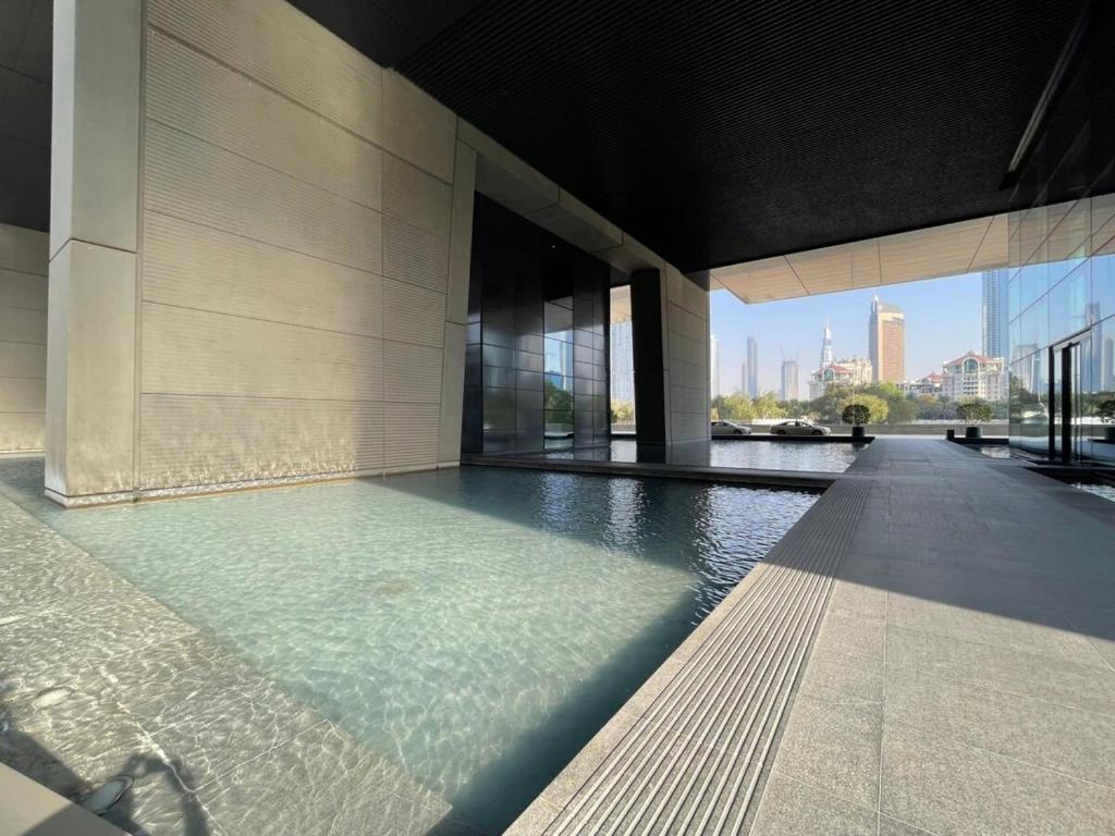 a swimming pool on the side of a building at Silkhaus Index Tower 1BDR with stunning view in DIFC in Dubai